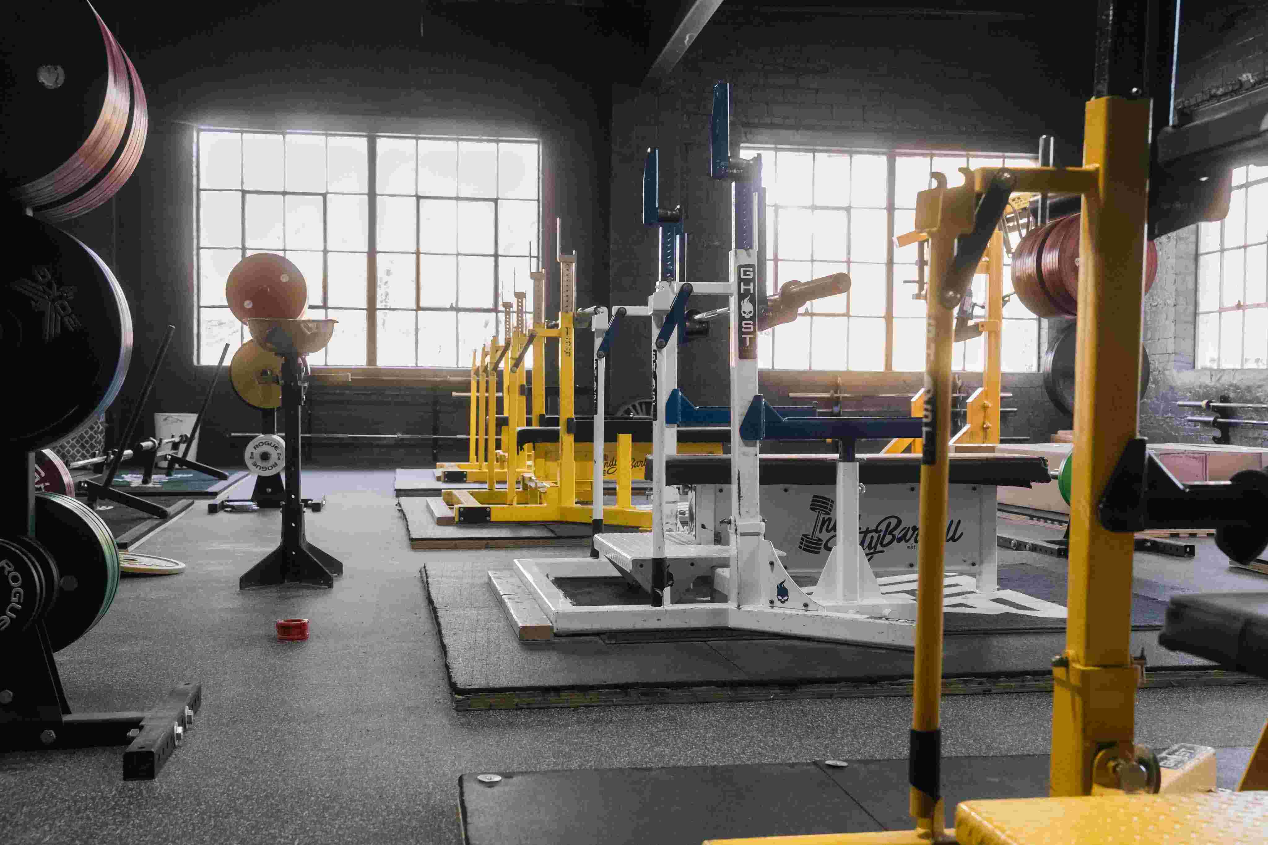 Member training with free weights at Indy City Barbell gym in Indianapolis