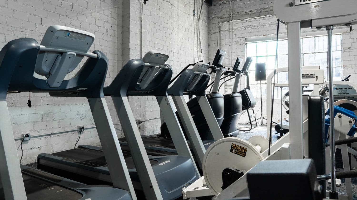 Cardio machines and treadmills at Indy City Barbell gym in Indianapolis