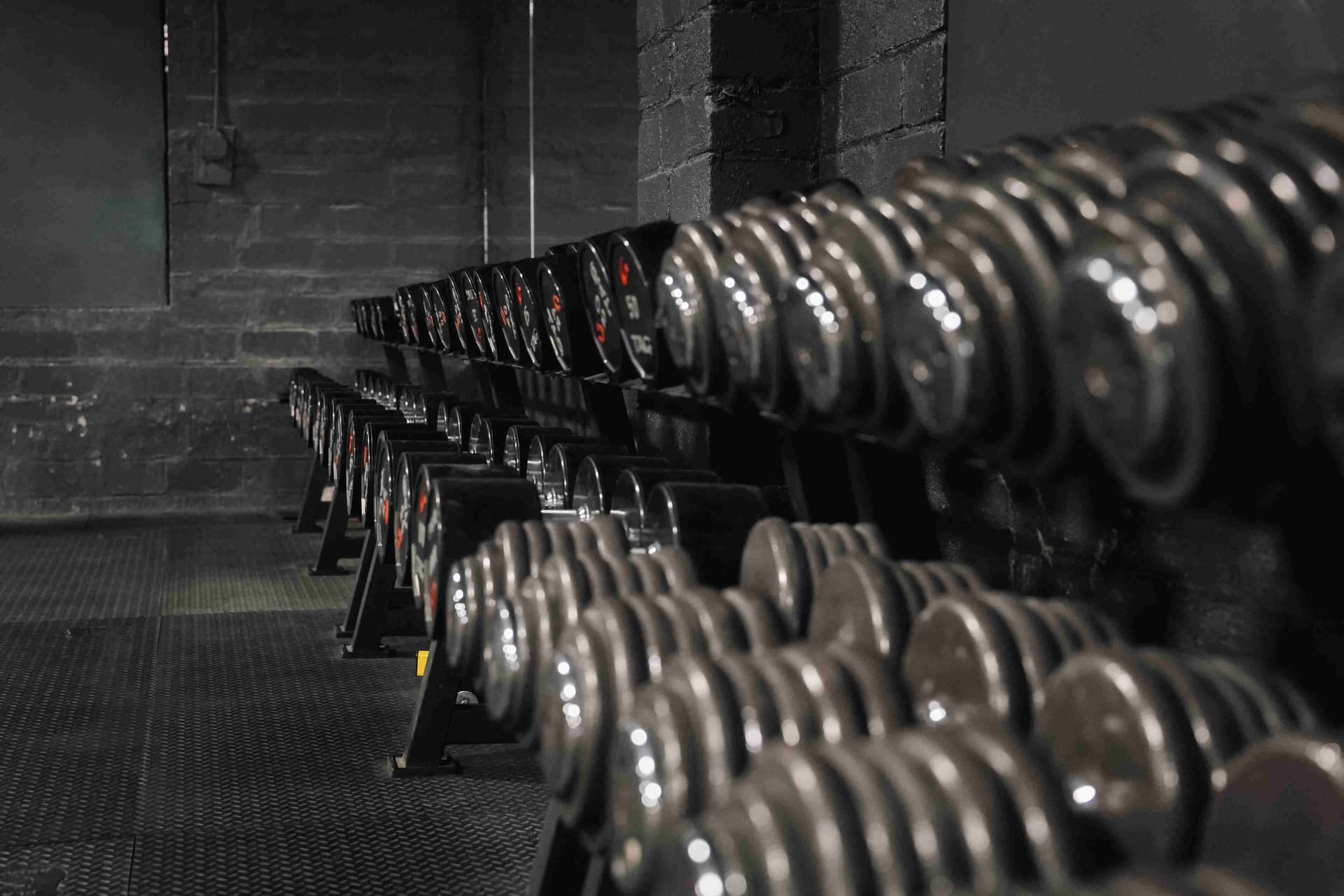 Power racks and lifting platforms on the powerlifting floor at Indy City Barbell