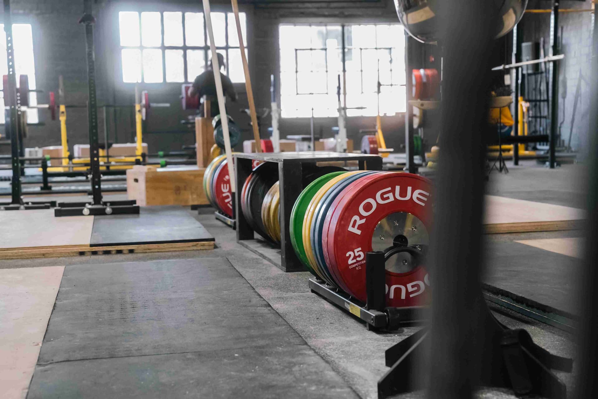 Calibrated plates and barbells staged for training at Indy City Barbell