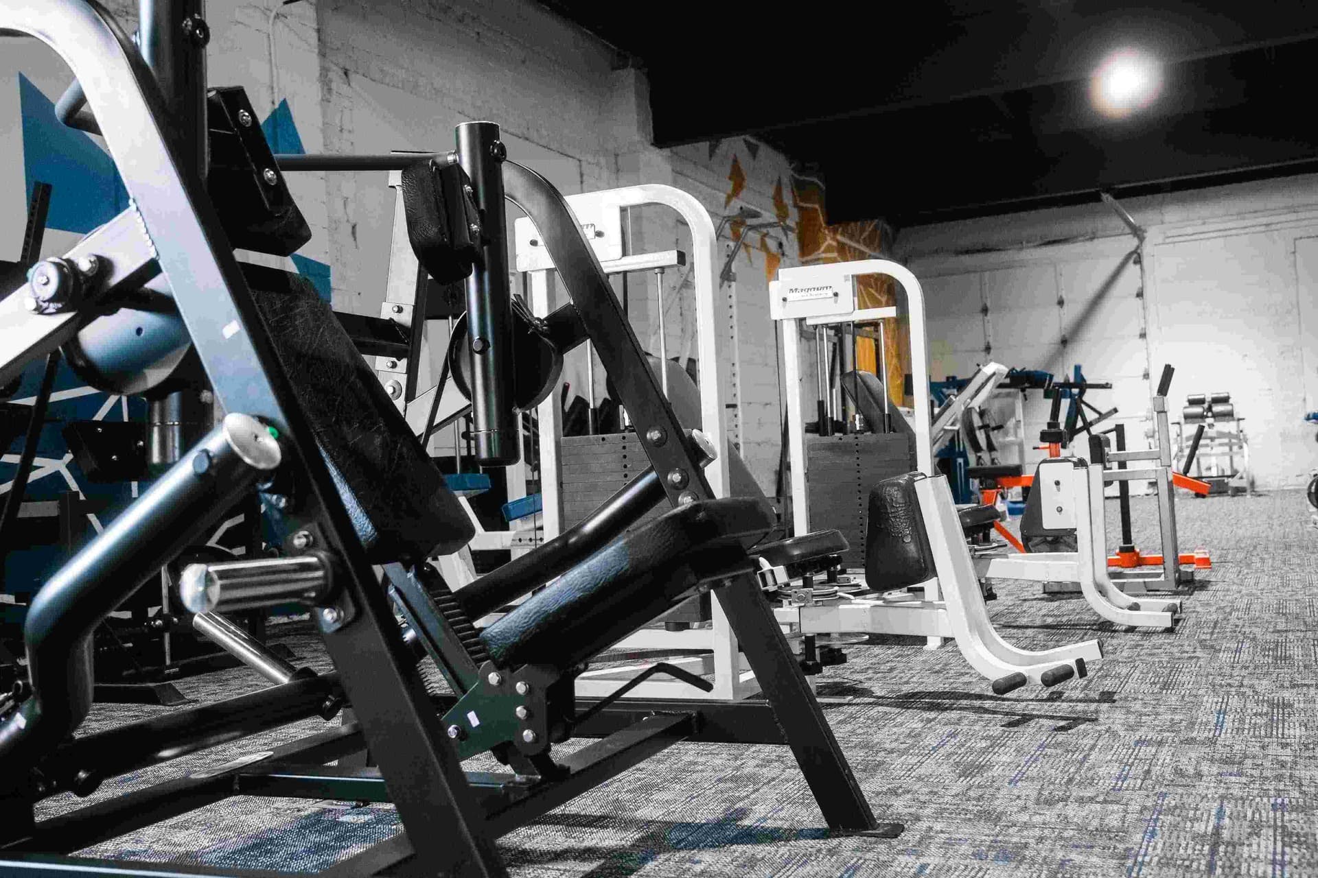 Strength training zone with plates and racks at Indy City Barbell